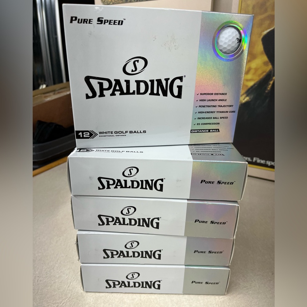 (5) Dozen Spalding golf balls.